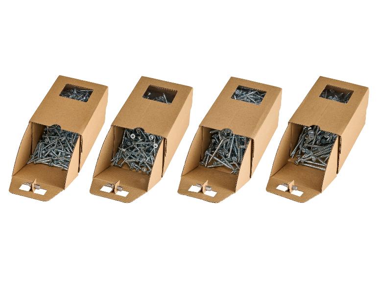 Vier kartonnen dozen met metalen schroeven en een schroevendraaierbit.
