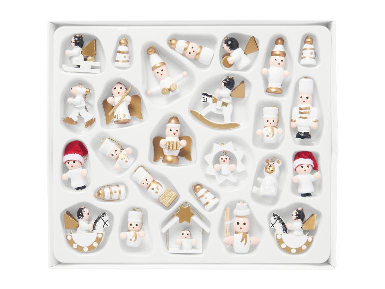 Set van witte en gouden miniatuur kerstornamenten in een doos.