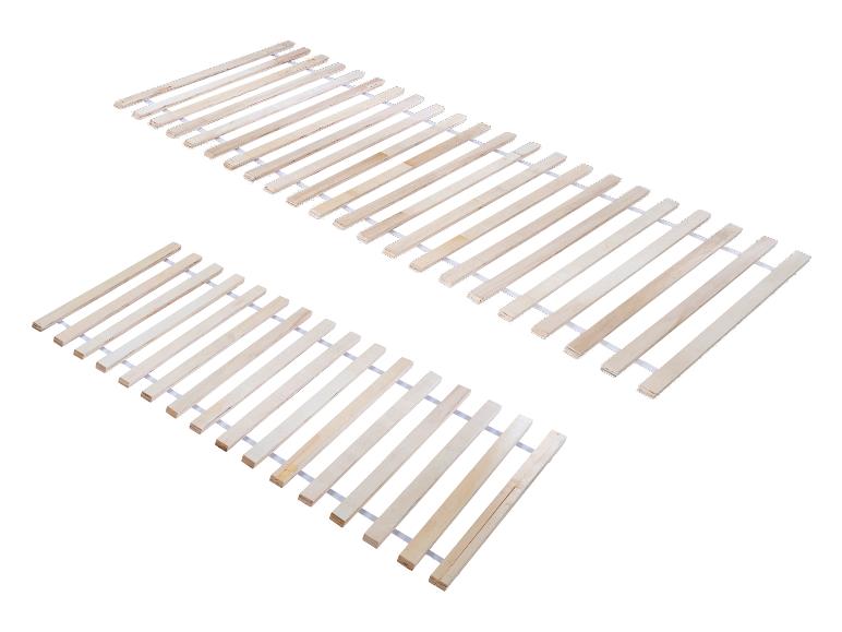 Twee sets houten bedlatten, liggend op een wit oppervlak