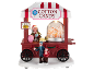 Decoratieve suikerspinwagen met figuren en de tekst 'Cotton Candy'.