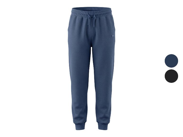 Heren joggingbroek in blauw en zwart met trekkoord.
