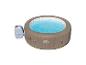 Opblaasbare jacuzzi met turquoise water en externe pomp.