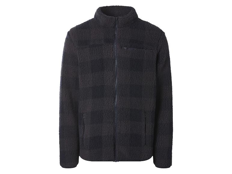 Donkerblauwe fleece jas met rits en zakken.