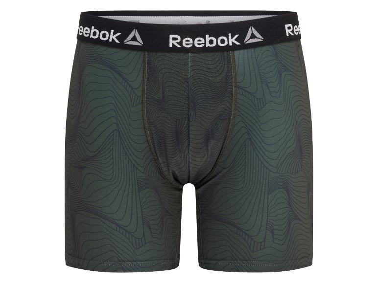 Groene Reebok herenboxershorts met een zwarte tailleband en golvend patroon.