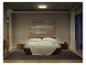 Een moderne slaapkamer met een bed, nachtkastjes en een plafondlamp, wat een gezellige sfeer creëert.