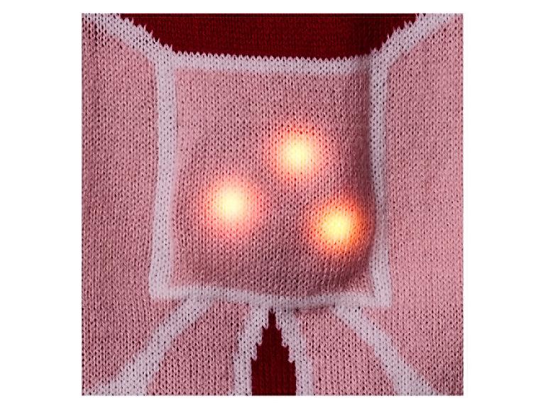 Gebreide trui met drie oplichtende lichtjes.