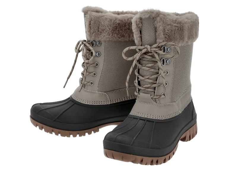 Paar beige en zwarte winterlaarzen met imitatiebont voering en veters