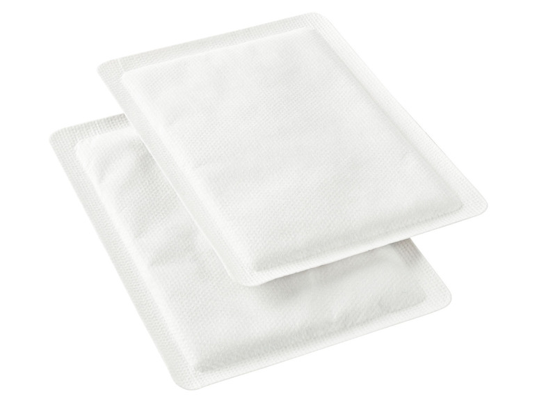 Twee witte warmtekussens voor pijnverlichting.