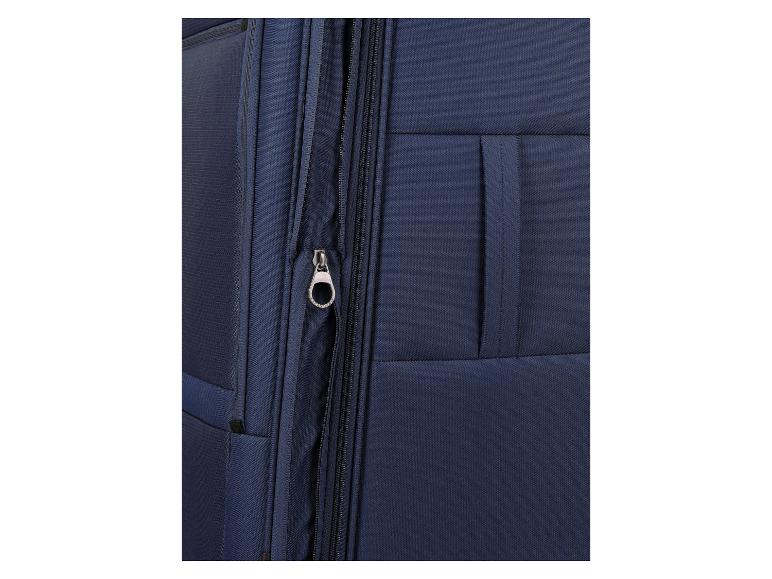 Close-up van een blauwe koffer met rits en ritstrekker.