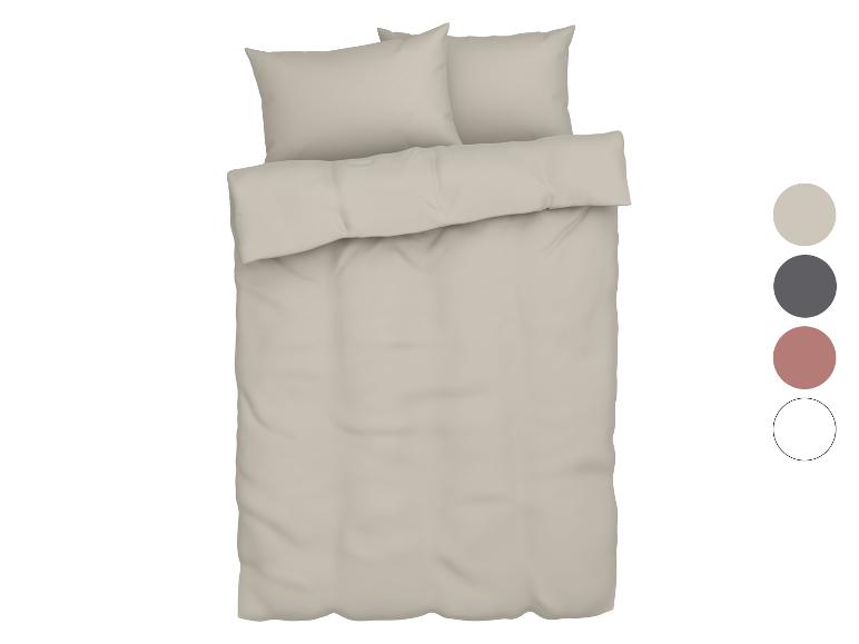 Lichtbeige beddengoedset met kussens.