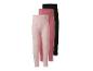 Drie meisjesleggings: één roze met stippen, één effen roze en één effen zwart.