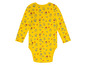 Gele baby romper met huisjes print.