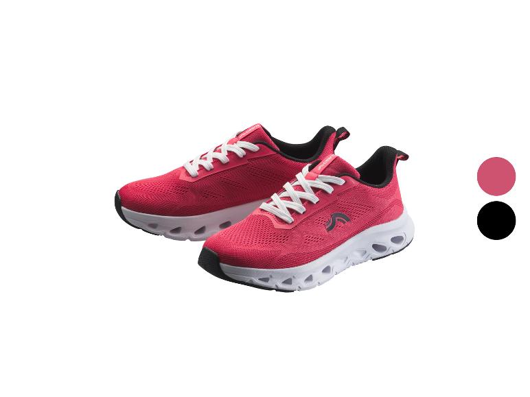 Een paar roze sportschoenen met witte veters en een witte zool
