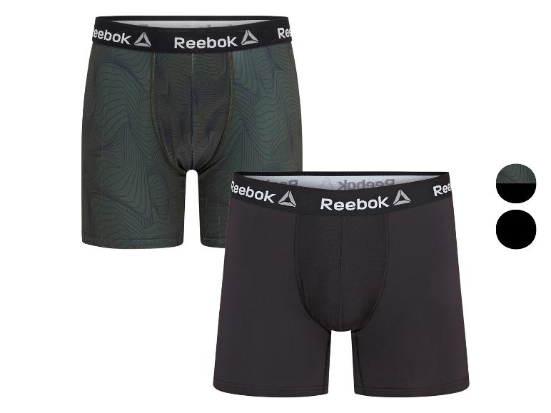 Twee heren Reebok boxershorts, één groen met patroon en één zwart.