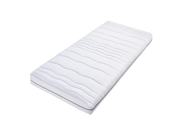 Een wit matras met een golfpatroon.