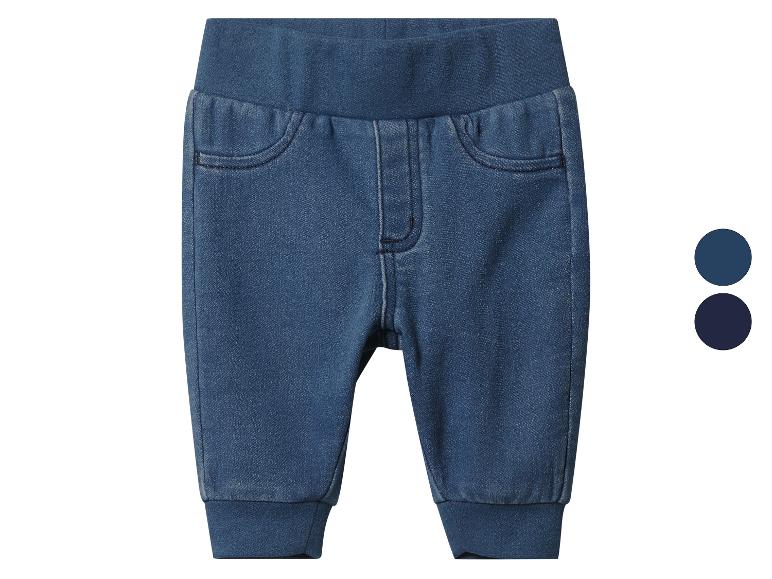 Blauwe denim babybroek met elastische taille en boorden.