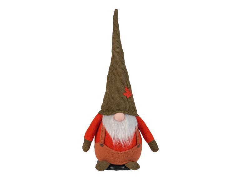 Herfstgnome in oranje broek en groene muts.