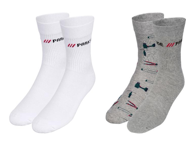 Twee paar Parks sokken: een paar witte en een paar grijze met gereedschapsmotief.