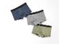 Drie boxershorts in blauw, grijs en groen