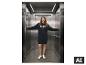 Vrouw in ESMARA® Dames Sweatkleed met de tekst 'PARIS AIMÉE' in een lift. [AI-gegenereerde afbeelding]