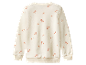 Een beige kindertrui met kleine bloemenprint.