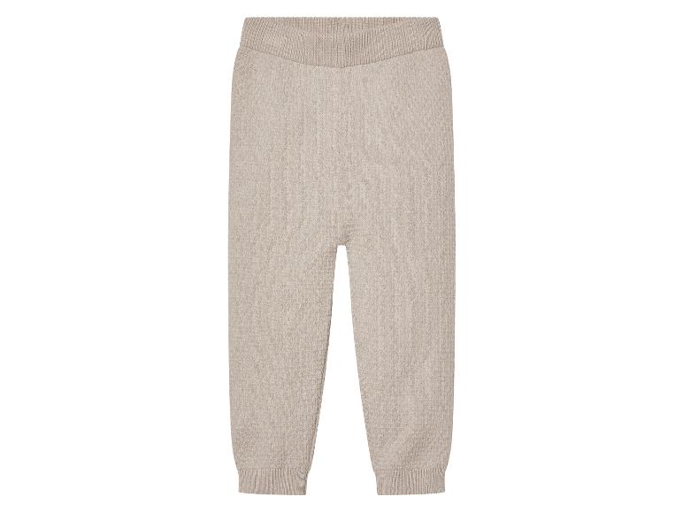 Beige gebreide broek met een elastische tailleband.