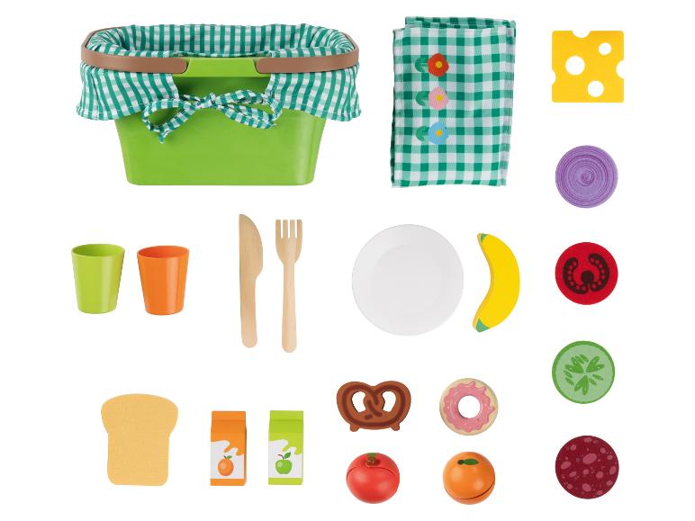 Speelgoed picknickmand met eten en servies.