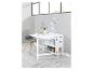Witte opklaptafel met laden en plank.