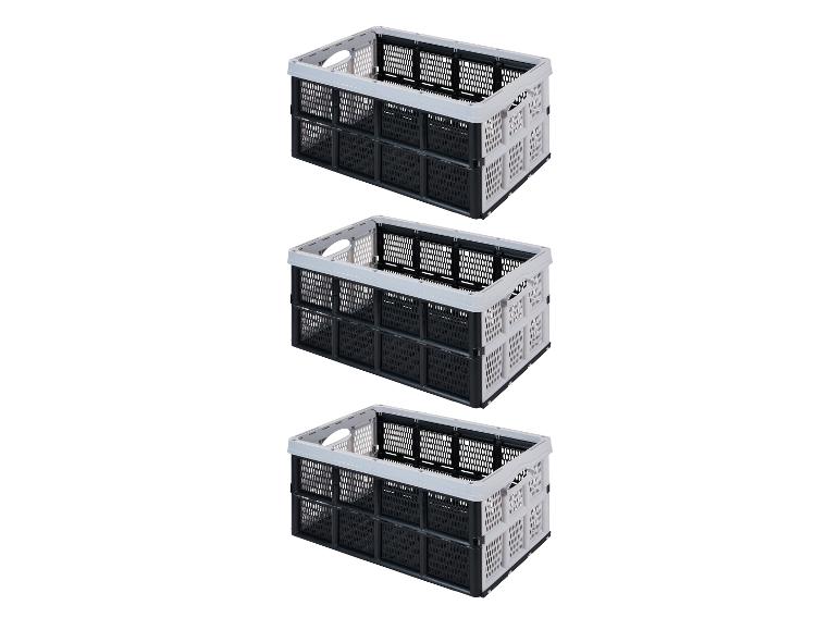 Drie opvouwbare opbergmanden in zwart en grijs.