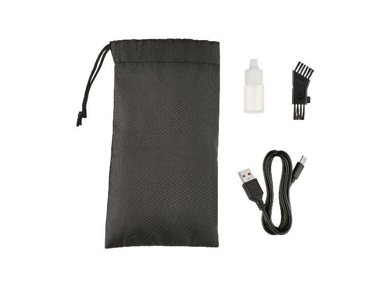 Accessoires voor een tondeuse: opbergtasje, olie, reinigingsborstel en USB-oplaadkabel.
