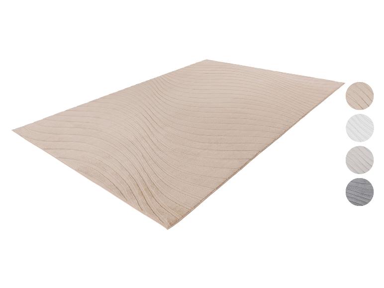 Beige tapijt met golvend patroon en kleurstalen