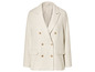 Een crèmekleurige blazer met gouden knopen.