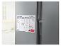 Magnetische maandplanner op koelkast, met stift en wisser.