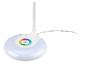 Witte bureaulamp met verlichte ronde voet en een kleurrijke cirkel.