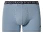 Lichtblauwe katoenen boxershort met donkere elastische tailleband met tekst en ruiterlogo.