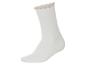 Witte kindersokken met decoratieve rand.