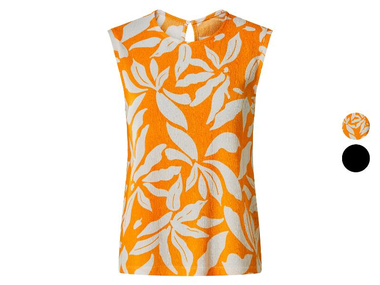 Oranje mouwloze top met witte bladprint en kleurdetails.