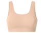 Naadloze beige sportbeha voor dames.
