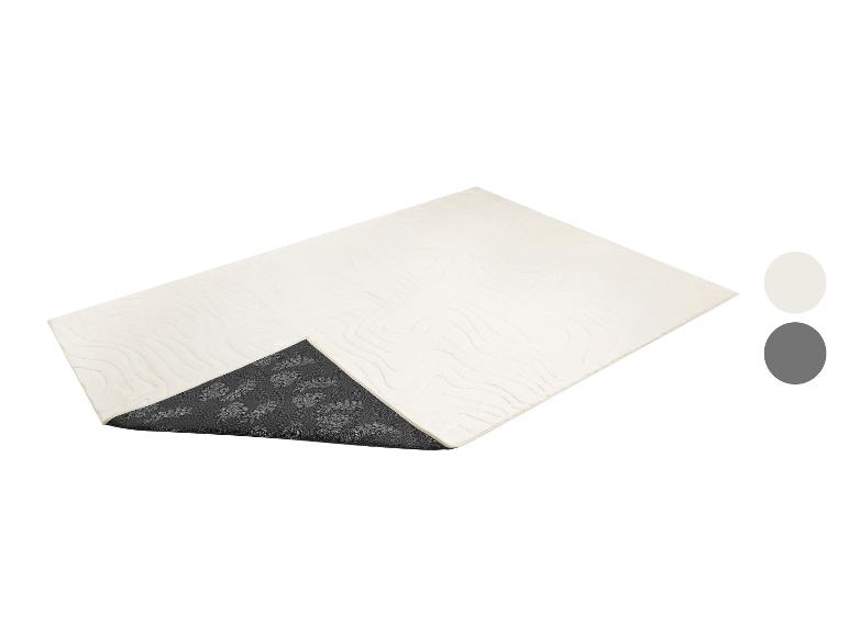 Crèmekleurig rechthoekig vloerkleed met abstract patroon en donkergrijze antislip onderkant