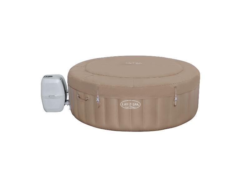 Opblaasbare jacuzzi in beige met externe verwarmingseenheid.