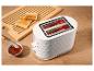Witte broodrooster met geroosterd brood, jam en een houten snijplank.