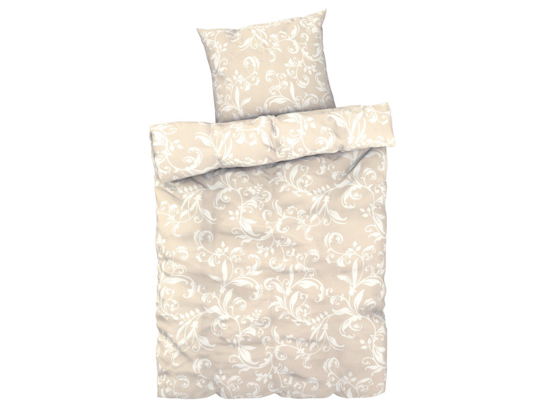 Beige beddengoed met wit bloemmotief.