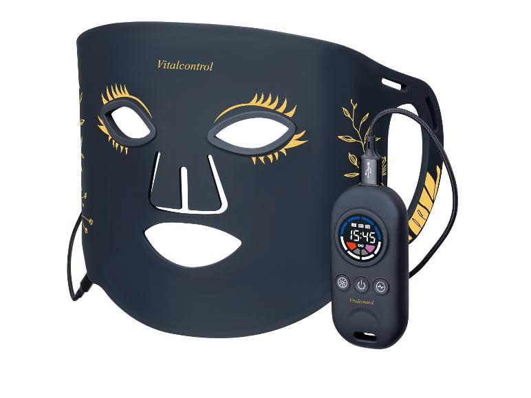 Gezichtsmasker met controller, met gouden wimpers en bladmotieven.