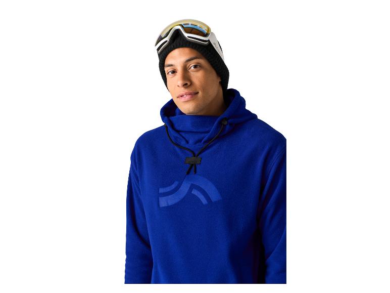 Man in blauwe hoodie en skibril.