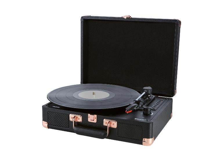 TRONIC kofferplatenspeler in zwart met koperen accenten, open, met een vinylplaat.