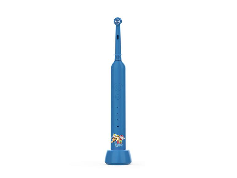 Blauwe PAW PATROL elektrische tandenborstel op een oplaadstation