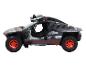 Een zwart Audi e-tron off-road model met rode wielen.