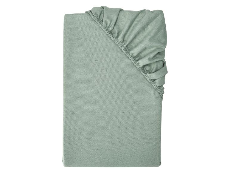 Lichtgroen opgevouwen hoeslaken met elastiek