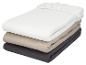 Stapel hoeslakens in wit, beige en grijs