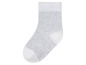 Witte sok met grijze strepen.